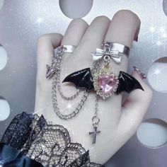 This Gothic Punk Angel Wings Bowknot Cross Ring is the perfect addition to add an edgy touch to any outfit. Multi-layers of cross and wings accents, coupled with bowknot detailing give this ring a truly unique look. Dare to make a statement with this fashionable yet unique ring! Alternative Style Halloween Jewelry As A Gift, Punk Alloy Jewelry For Halloween, Silver Punk Jewelry For Cosplay, Edgy Halloween Rings For Gift, Emo Jewelry For Halloween Cosplay, Alternative Metal Jewelry For Cosplay, Silver Edgy Jewelry For Cosplay, Edgy Adjustable Rings For Halloween, Edgy Silver Jewelry For Cosplay