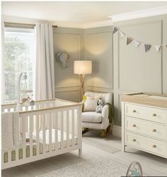 a baby's room is decorated in neutral colors