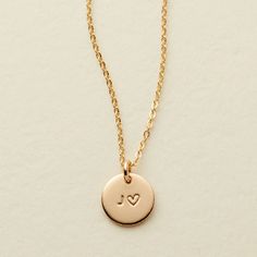 The Amora Disc is a meaningful disc necklace to carry a loved one with you wherever you may go. Always remember your mother, husband, or friend whether they are near or far with their initial hand stamped alongside on a 3/8" disc pendant chain. Available in gold filled, sterling silver and rose gold filled. Semicolon Symbol, Mary Jewelry, Gold Bar Necklace Personalized, Hamsa Necklace Gold, Dainty Necklace Layered, Gold Disc Necklace, Hamsa Necklace