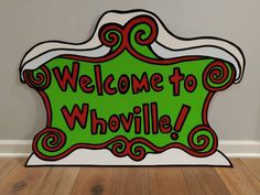 a welcome sign with the words'welcome to whovillee'in red and green