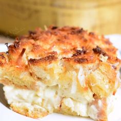 a close up of a plate of food with a casserole in the background