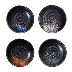 four black plates with brown and blue designs on the top one has white speckles