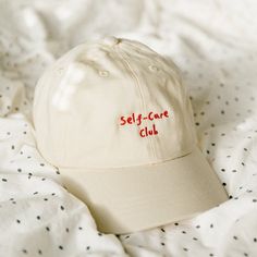 'Self-care club' embroidered cap is a must have accessory for any outfit. Whether you plan to go out on a sunny day or bringing it with you in case it rains, this cap will take care of you. While you spread the positive message and make everyone around you smile :) 🚚 SHIPPING 🚚 All of our items are made to order the moment you place your order and are never mass produced. All of the orders ship within 24-48h, in case of any exception or delays you will be notified. Cap Aesthetic, Minimal Shirt Design, Message Positif, Self Love Club, Embroidered Cap, Embroidered Caps, Love Phrases, Love Club, Positive Messages