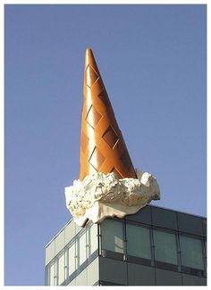 an ice cream cone on top of a building