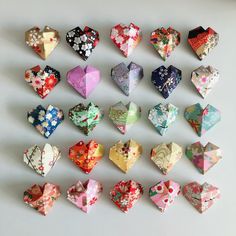 a bunch of origami hearts arranged on a table