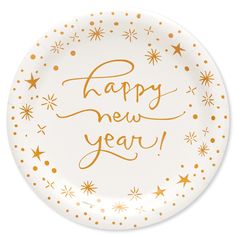 a happy new year paper plate with gold stars and confetti on the rim