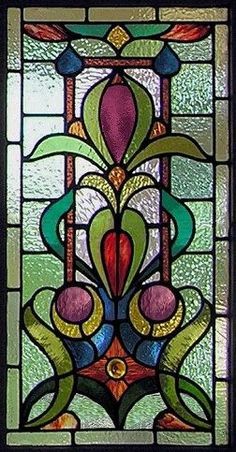 a stained glass window with an abstract design