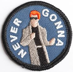 a patch with the words never gon na in white and an image of a man wearing