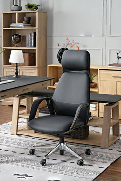 a black office chair sitting in front of a desk