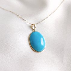 This stunning pendant is set in 14K Solid Yellow Gold with Natural Sleeping Beauty Arizona Turquoise with utmost precision. It is an unique gemstone pendant for nearly every occasion and is completely hassle-free jewelry. 🔷ABOUT GEMSTONE: Turquoise is a vibrant and highly valued gemstone that has been used for its beauty and perceived metaphysical properties. Turquoise is believed to provide protection against negative energies and harmful influences. It is thought to act as a shield, helping t Elegant Turquoise Necklace With Oval Pendant, Elegant Oval Turquoise Necklace With Large Pendant, Yellow Gold Oval Turquoise Necklace Gift, Oval Yellow Gold Turquoise Necklace As Gift, Oval Turquoise Necklace In Yellow Gold As Gift, Hallmarked Oval Turquoise Necklace, 14k Gold Turquoise Necklace For Gift, Fine Jewelry Yellow Gold Turquoise Gemstone Necklace, Fine Jewelry Turquoise Gemstone Necklace In Yellow Gold