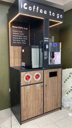 a coffee machine sitting on top of a wooden cabinet