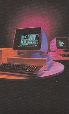 an old computer sitting on top of a table next to a keyboard and monitor screen