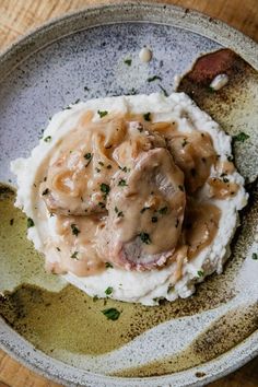 mashed potatoes covered in gravy on a plate