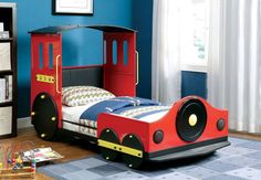 a child's bed made to look like a train car with wheels on it