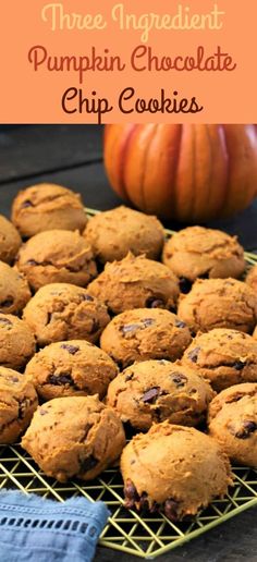 three ingredient pumpkin chocolate chip cookies on a cooling rack with a pumpkin in the background