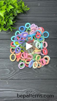 the video is showing how to make paper clips with scissors and glue on wood planks