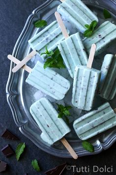 mint and chocolate pops on a plate with toothpicks in the middle, ready to be eaten