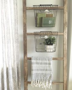 an old ladder is used as a towel rack