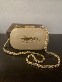 Gorgeous Sabyasachi inspired clutch with a shiny finish. The frame is covered with the same shiny material. It comes with a sling and will fit any regular sized cell phones.  Size: 7.5 L x 2 W x 4.5 H inches approx. Packaging: We offer top class packaging with extra protection. Shipping tracking numbers will be provided. We ship the order within 2-3 business days. It is upon the buyer to track their shipment. Shipping usually takes 3 to 5 days within USA. Returns policy: Returns are not accepted Designer Gold Clutch Evening Bag, Gold Clutch Openable For Party, Gold Rectangular Clutch For Gala, Designer Gold Evening Bag For Gala, Gold Formal Clutch With Openable Detail, Formal Clutch Evening Bag, Designer Gold Clutch For Gala, Formal Gold Clutch, Luxury Party Evening Bag