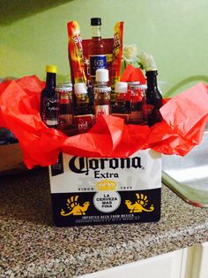 a box filled with corona beer sitting on top of a counter