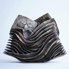 an abstract sculpture made out of metal and wood