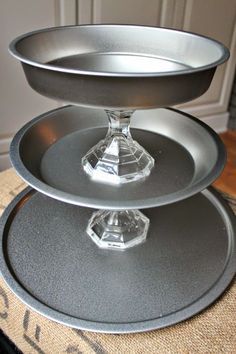 three tiered cake pans sitting on top of each other