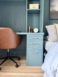 a chair sits in front of a desk with a bookcase on top of it