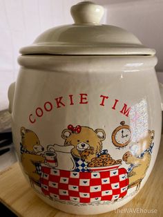 a cookie time pot sitting on top of a wooden table