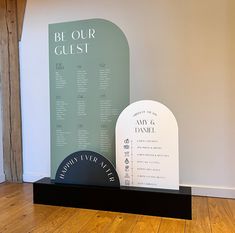 a couple of tombstones sitting on top of a hard wood floor next to a wall