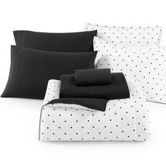 black and white bedding with polka dots on the sheets, pillows and pillow cases