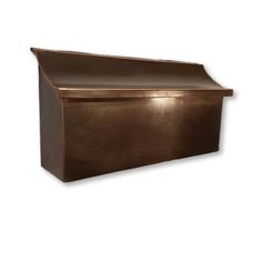 a copper mailbox on a white background