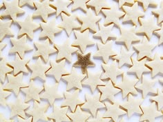 star shaped cookies are arranged on a white surface