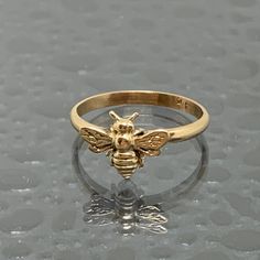 This is a 14kt solid gold Honey Bee Ring made in our studio in Ohio. These rings are available in various sizes and are made to order, so allow us a couple days extra for time in our studio. This ring will be a fantastic gift for yourself or that someone special. Keep in mind the Bee is very mischievous and can get caught in loose clothing and hair on occasion. We have tried various methods to eliminate this by offering the option of no antennae. Free Insured Priority Shipping to the US. Quirky Ring, Bee Ring, Bee Jewelry, Gold Bee, Authentic Jewelry, Fashion Statements, The Bee, Girly Jewelry, Nature Jewelry