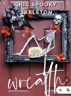 a skeleton is standing in front of a red door with the words wreath written on it