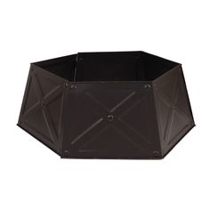 a black metal planter with an octagonal design on the top and bottom, sitting in front of a white background