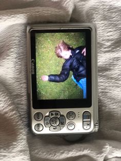 there is a cell phone with a photo on it