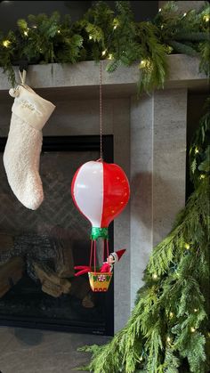 an air balloon hanging from a christmas tree