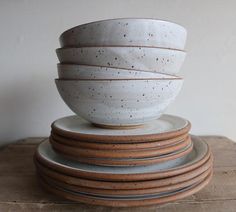 a stack of ceramic bowls sitting on top of each other