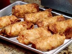 some fried food is sitting on a pan