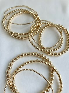 "DETAILS - Handmade in USA - Seamless Round 14k Gold Fill 2mm, 4mm, 5mm - 100% Natural Gemstones, No Heat or Dye - AAA Gemstones - Can Be Gift Wrapped PRODUCT INFO Now offering our first bracelet set! 3 bracelets in each set. Each stack a 2mm, 4mm and 5mm 14k gold fill beaded bracelet. All beads are smooth and seamless. Great gifting set for moms, friends, sisters, teachers and more. Sized so they can be worn together as a full stack or give them out separately but save a little money doing so v Good Beaded Bracelets, Gold Filled Bracelets, Beaded Gold Bracelet, Gold Bead Bracelet Stack, Glass Skin Home Remedies, Beaded Bracelets Gold, Gold Bracelet Stack, Skin Home Remedies, Gold Beaded Bracelets