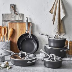 an assortment of pots and pans on a counter