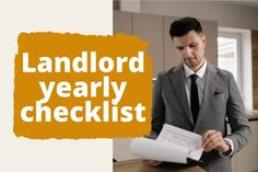 a man in a suit and tie holding a piece of paper with the words land lord yearly checklist