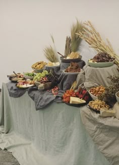 a table topped with lots of different types of food