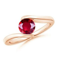 a ring with a red stone in the center and a twisted band around it, on a white background