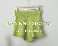 a pair of shorts hanging on a clothes hanger with the words, may knit shorts made to measure