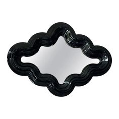 a black decorative mirror on a white background