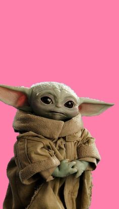 the child yoda from star wars is shown in front of a pink background