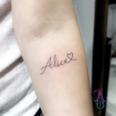 a woman's arm with the word alice written in cursive writing on it