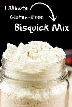 a glass jar filled with white powder next to a black and white sign that says minute gluten - free bisquick mix