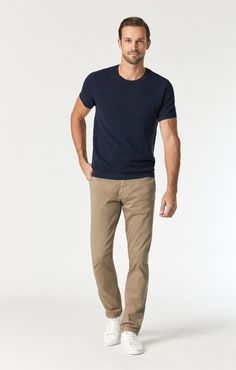 Clean and contemporary, the Johnny in British Khaki Twill is everything a basic should be. Featuring a slim, tapered leg, Johnny offers a polished look that's perfect for slightly dressier occasions especially in a versatile khaki. Durable twill is finely brushed for a hand-feel so soft you may want to invest in more than one of this staple. Model is 6'2.5" and wearing a size W32/L32 Fabric Contents 97% cotton, 3% elastane 8 oz fabric made In Turkey Mens Athletic Business Casual, Mens Style Smart Casual, Men’s Khaki Chino Outfits, Men's Business Casual Style Summer, Light Khaki Pants Outfit Men, Vuori Mens Outfit, Dark Khaki Pants Outfit Men, Men’s Khaki Pants Outfit